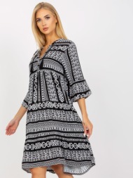 black patterned dress with ruffle and 3/4 sleeves