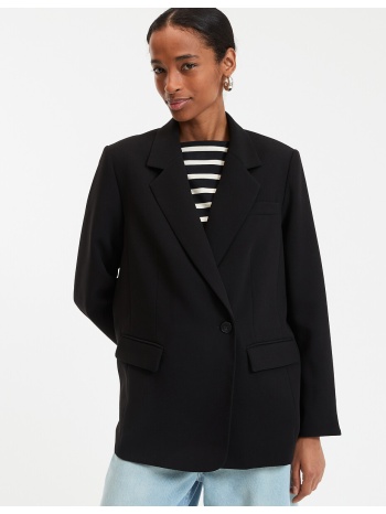 μακρύ μπλέιζερ με oversized κόψιμο και ασύμμετρο κούμπωμα