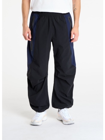 παντελόνια nike tech men`s dri-fit woven color-block σε προσφορά