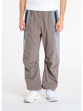 παντελόνια nike tech men`s dri-fit woven color-block σε προσφορά